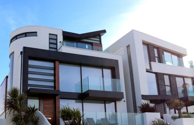 Modern home exterior, illustrating a monthly mortgage calculator with taxes and insurance